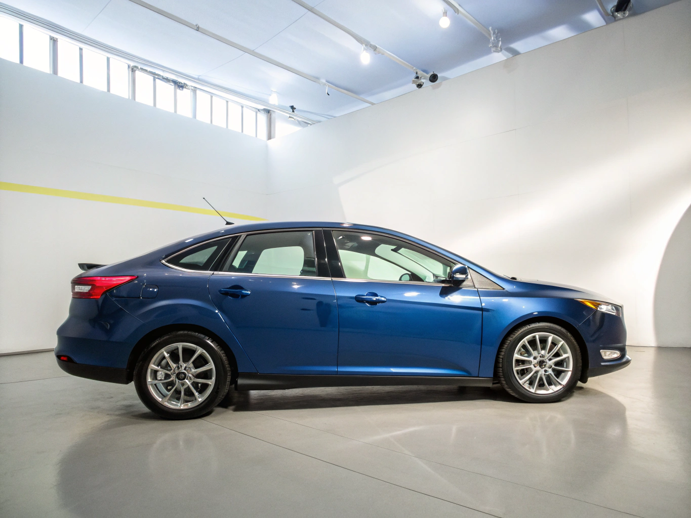 Refurbished used vehicles photographed in a clean indoor automotive showroom